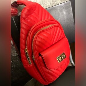 Red, quilted crossbody, Gold Hardwaremini backpack Caleesa Los Angeles.